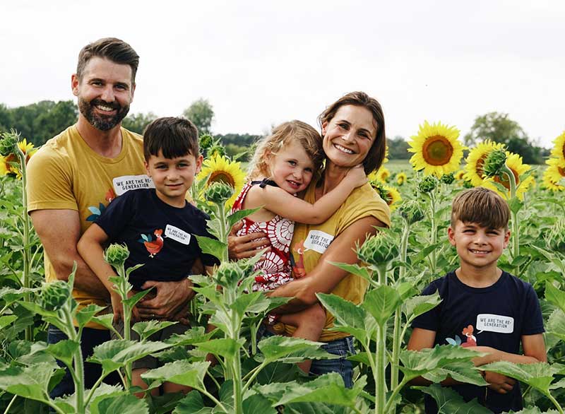 Seven Sundays founders and family in a field